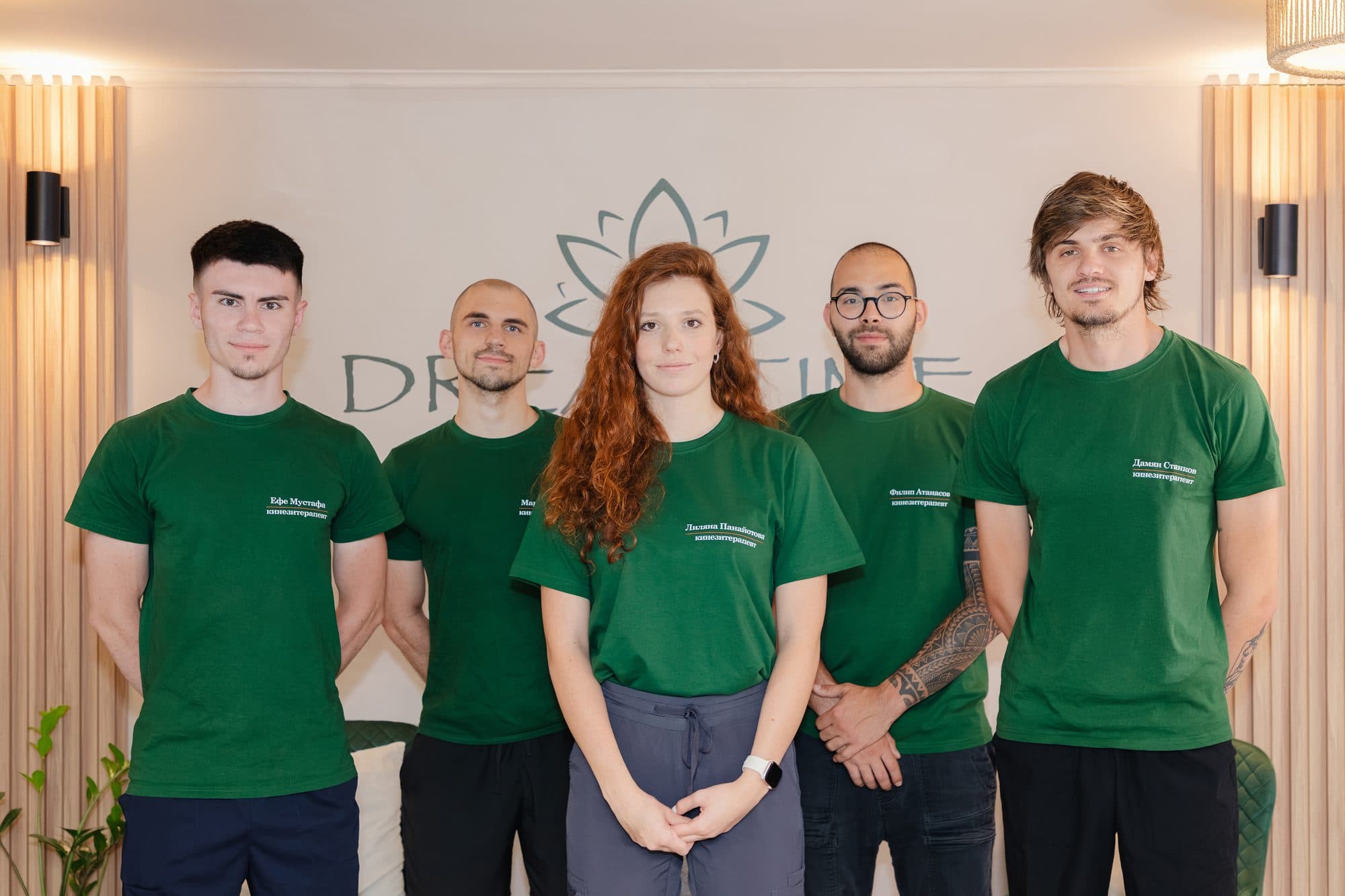 Петимата от екипа на DreamTime Studio пред логото в студиото